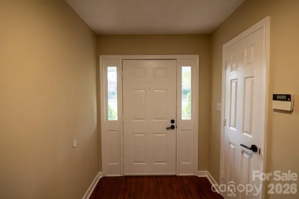 a view of a bathroom with wooden floor