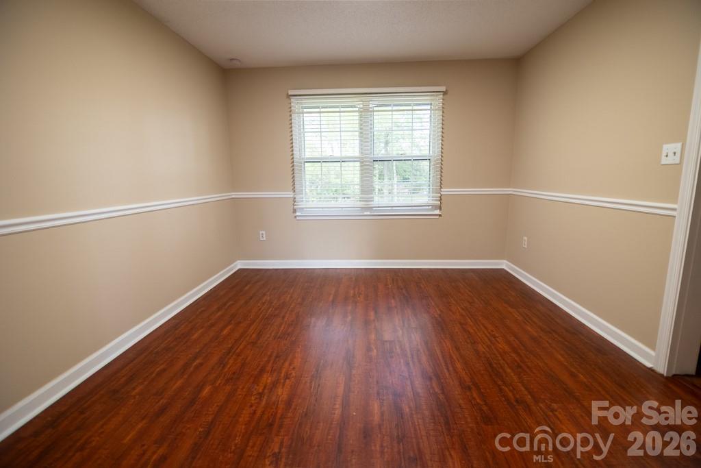 2232 Lawton Bluff Road Charlotte, NC 28226 - Photo 21 of 42 an empty room with wooden floor and windows