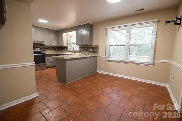a kitchen with a sink a counter top space and appliances
