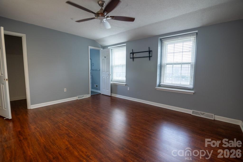 2232 Lawton Bluff Road Charlotte, NC 28226 - Photo 29 of 42 a view of an empty room with wooden floor and a window