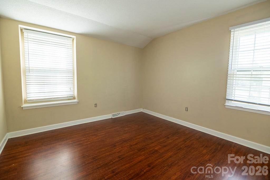 2232 Lawton Bluff Road Charlotte, NC 28226 - Photo 34 of 42 a view of a room with wooden floor and windows
