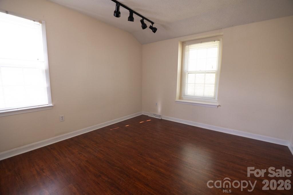 2232 Lawton Bluff Road Charlotte, NC 28226 - Photo 36 of 42 an empty room with wooden floor and windows