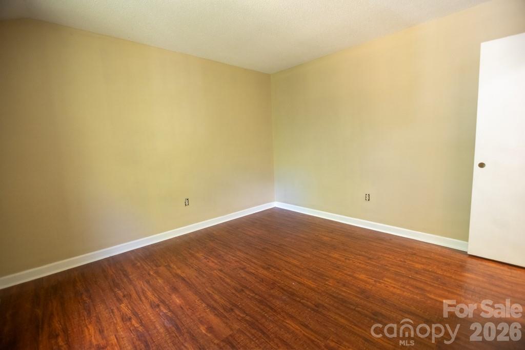 2232 Lawton Bluff Road Charlotte, NC 28226 - Photo 40 of 42 a view of an empty room with wooden floor