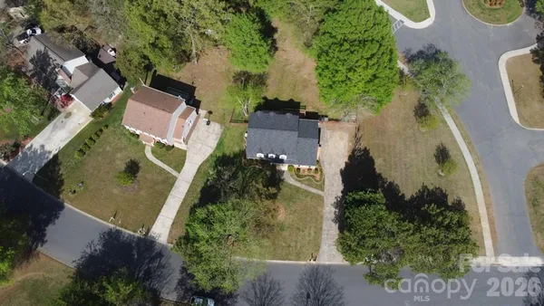 an aerial view of a house with outdoor space