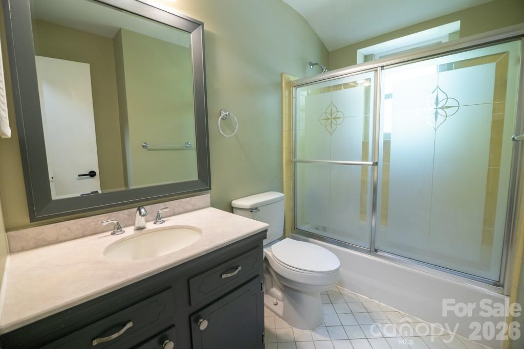 2232 Lawton Bluff Road Charlotte, NC 28226 - Photo 41 of 42 a bathroom with a sink a toilet and shower