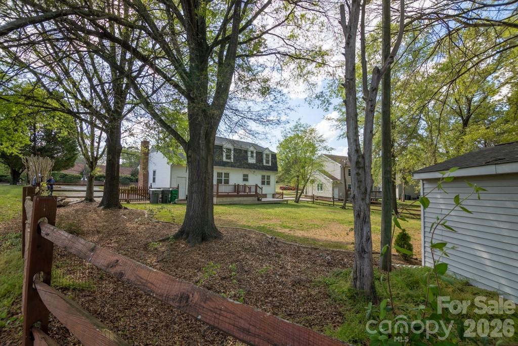 2232 Lawton Bluff Road Charlotte, NC 28226 - Photo 10 of 42 a view of a house with backyard and trees