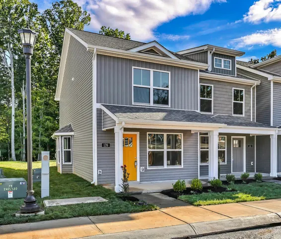 a front view of a house with garden