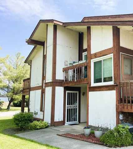 a front view of a house with garden