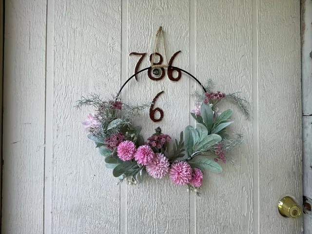 a vase of flowers sitting on a floor