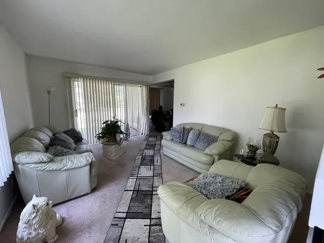 a living room with furniture and a couch
