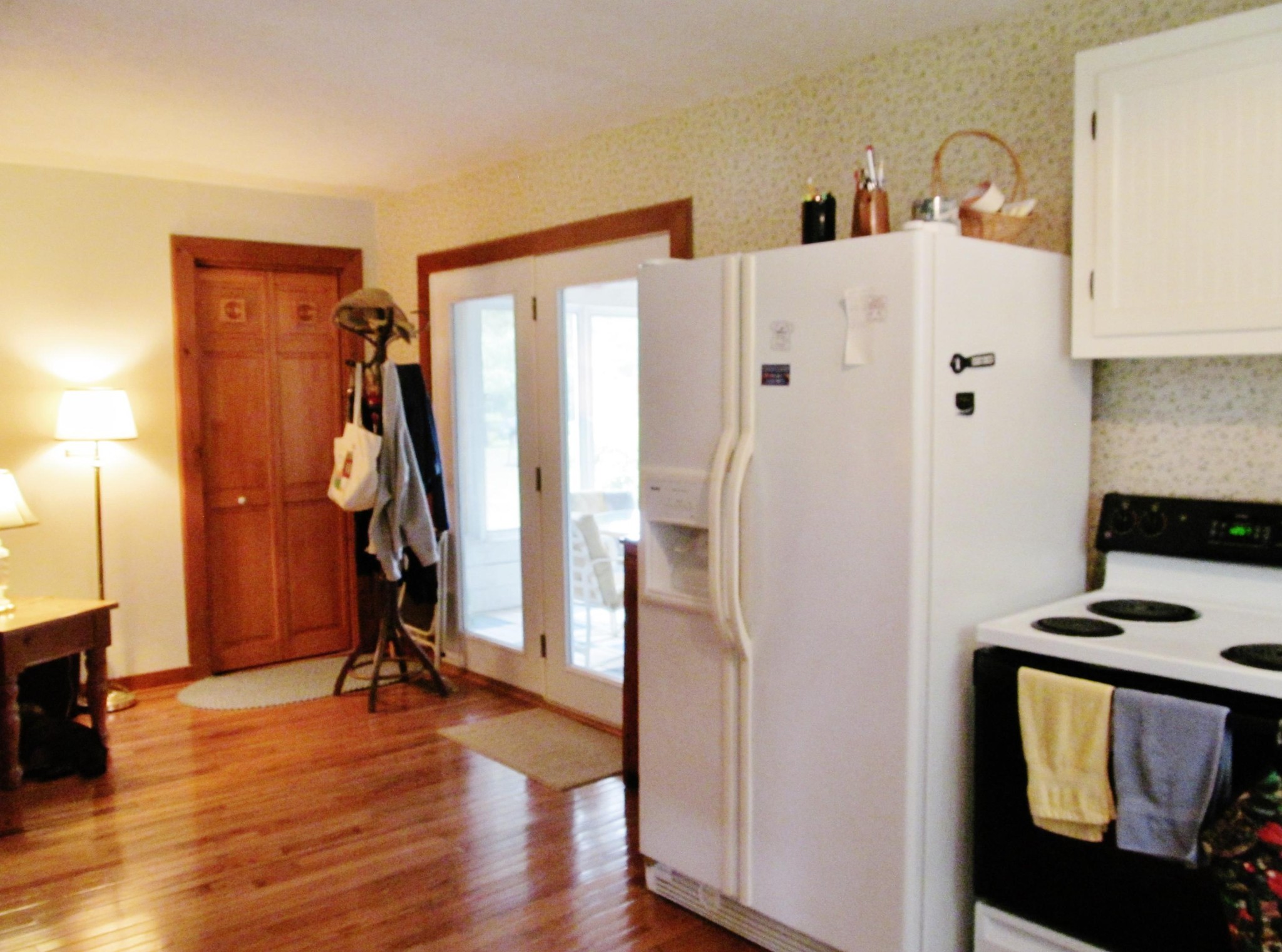 345 Landrum Hill Road Lancing, TN 37770 - Photo 7 of 37 a view of a kitchen with refrigerator and wooden floor
