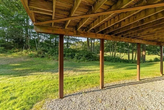 a view of a room with a big yard