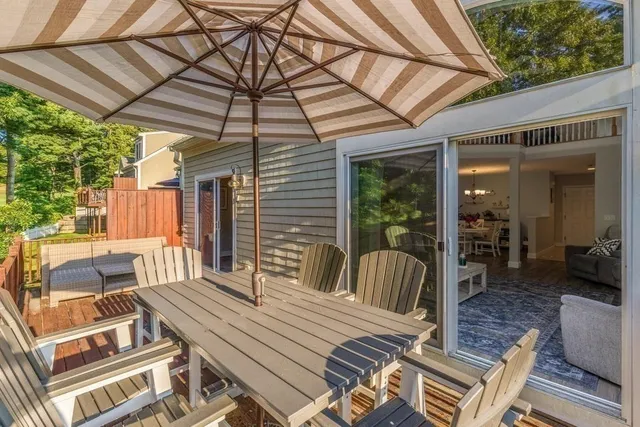 a view of a patio with a table and chairs