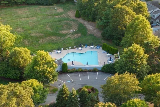 a aerial view of a house with a yard