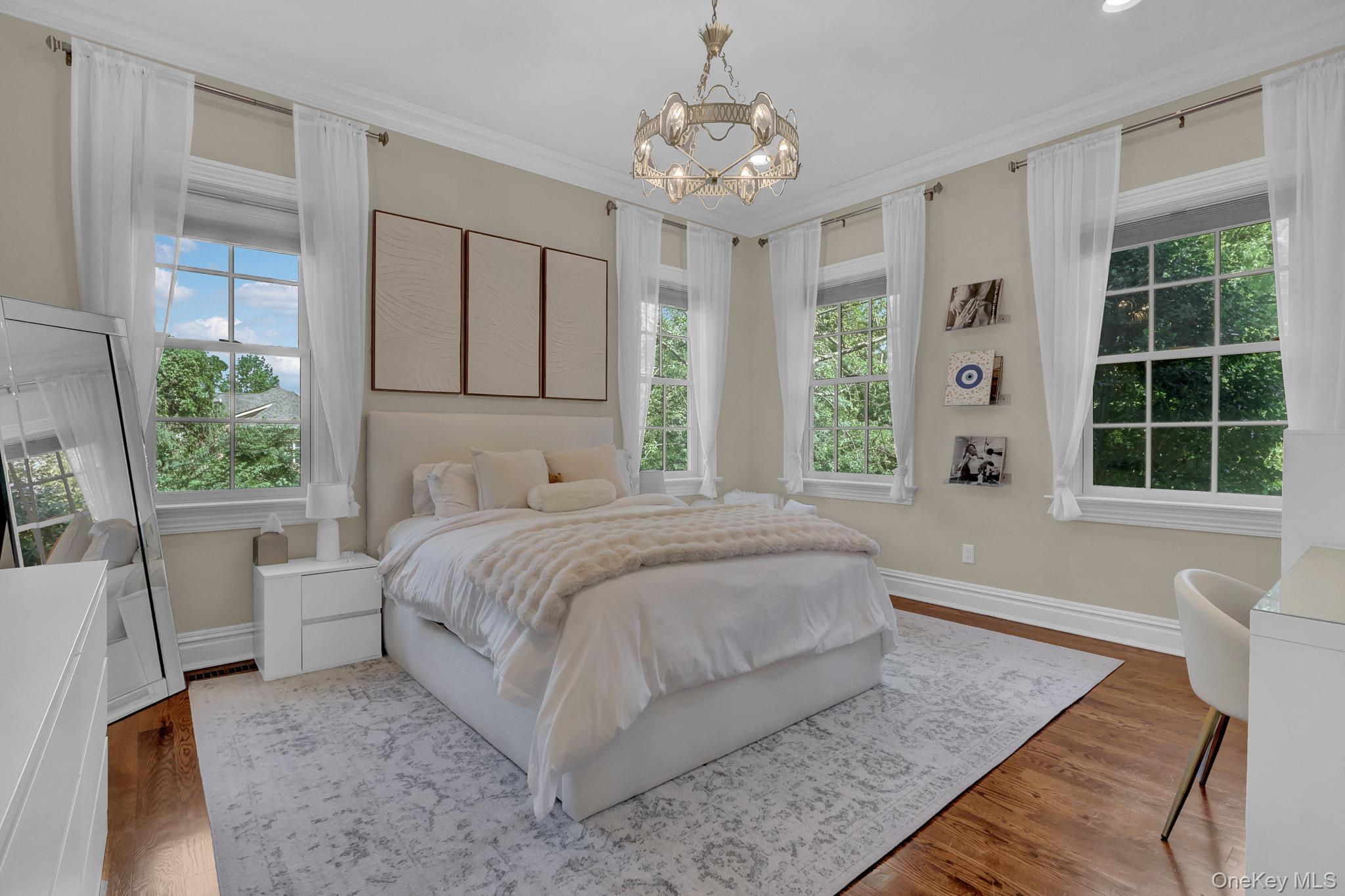 36 Old Field Road Setauket, NY 11733 - Photo 38 of 42 a spacious bedroom with a large bed and a window