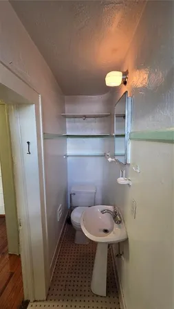 a view of empty room with window and ceiling fan