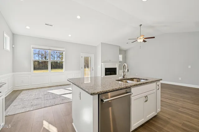 a kitchen with a sink stove and microwave