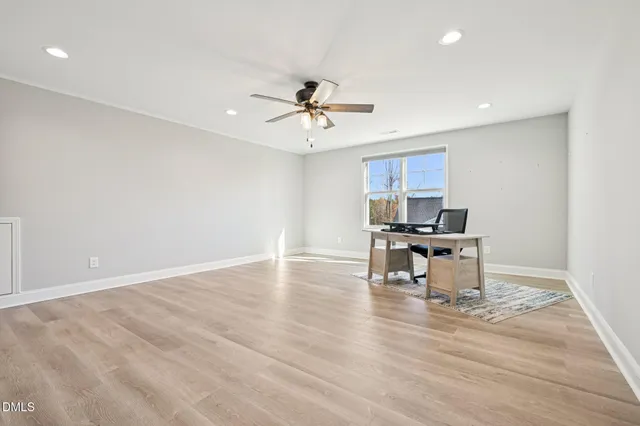 a view of kitchen with microwave stove and cabinets