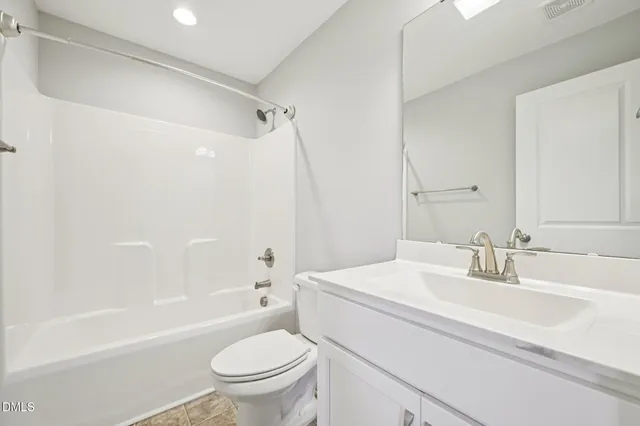 a view of a room with wooden floor and a yard