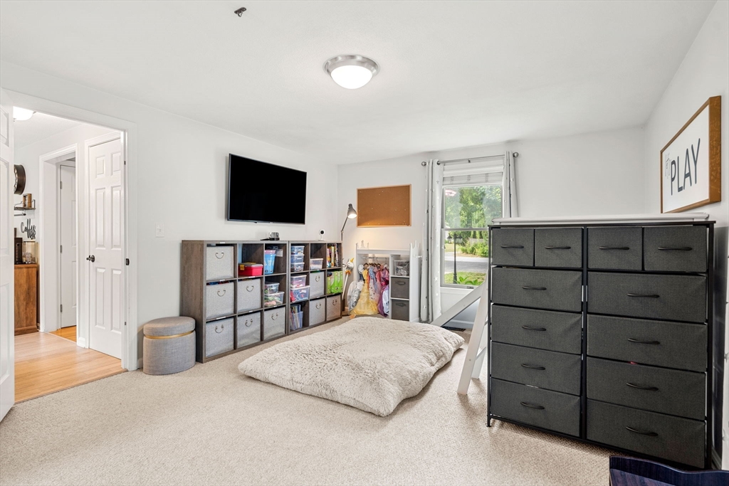 28 Andrews Farm Road Boxford, MA 01921 - Photo 17 of 42 a bedroom with a bed and a flat screen tv