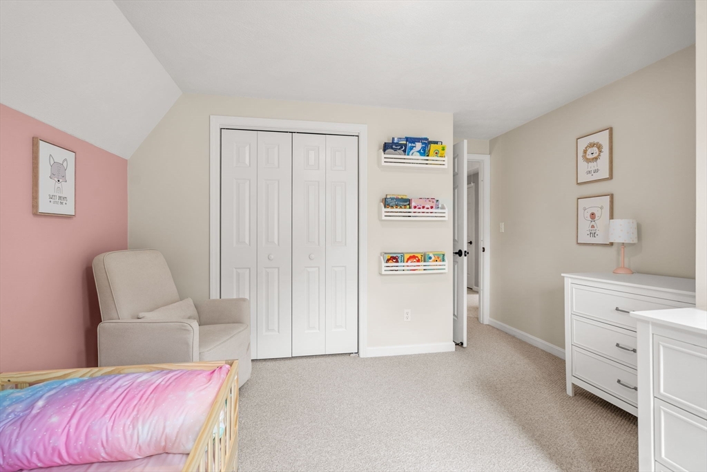 28 Andrews Farm Road Boxford, MA 01921 - Photo 24 of 42 a bedroom with a bed and a chair