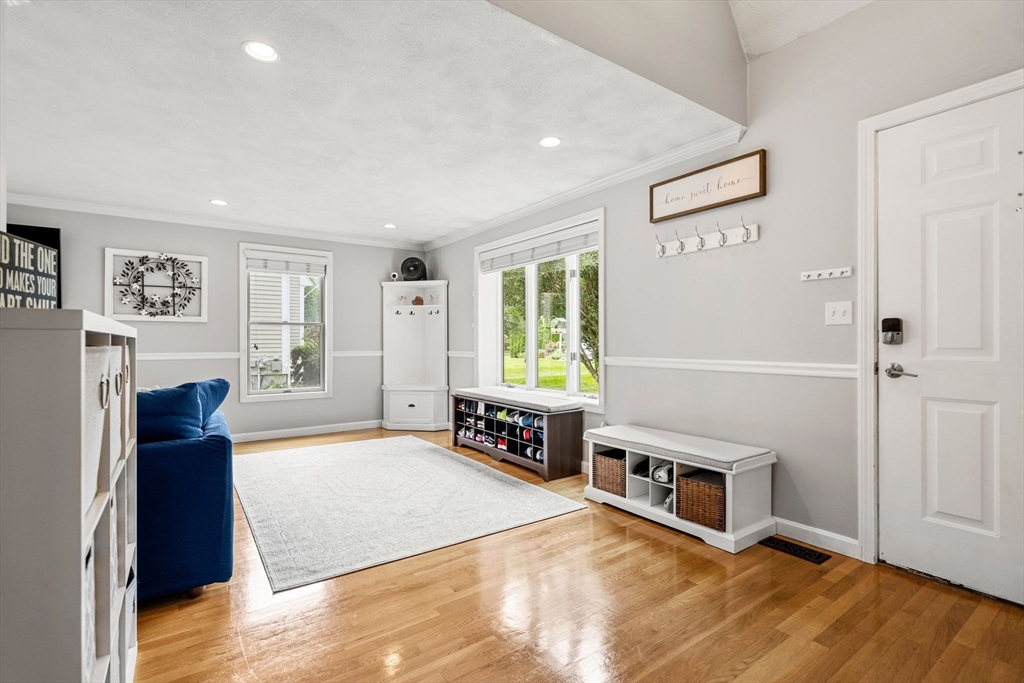 28 Andrews Farm Road Boxford, MA 01921 - Photo 5 of 42 a living room with furniture and a flat screen tv