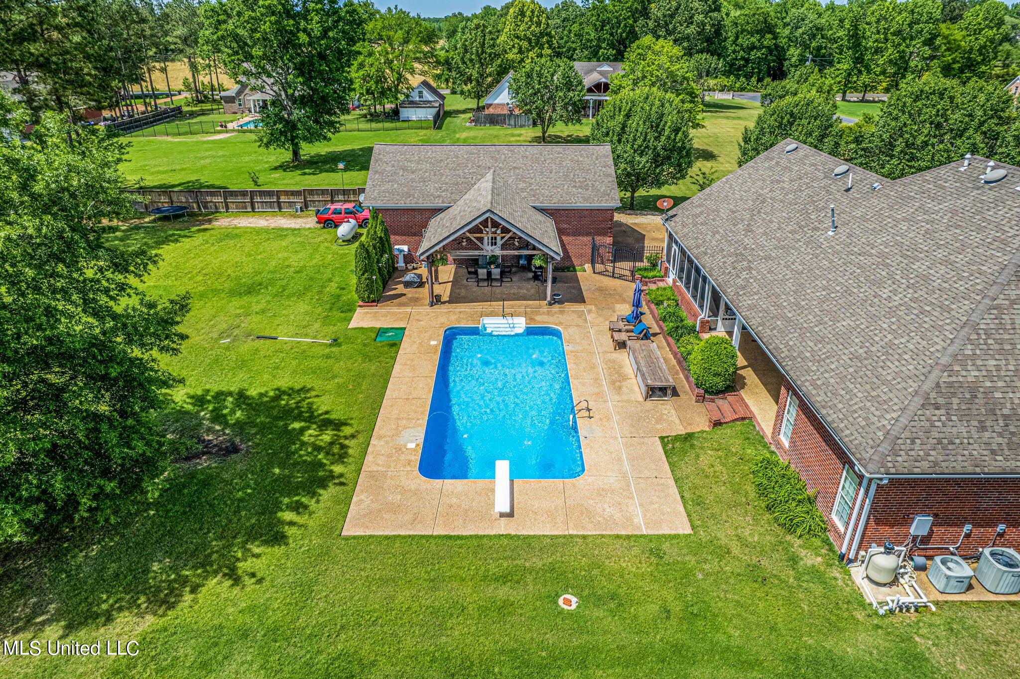 44 Myra Road Byhalia, MS 38611 - Photo 3 of 28 drone shot of pool area