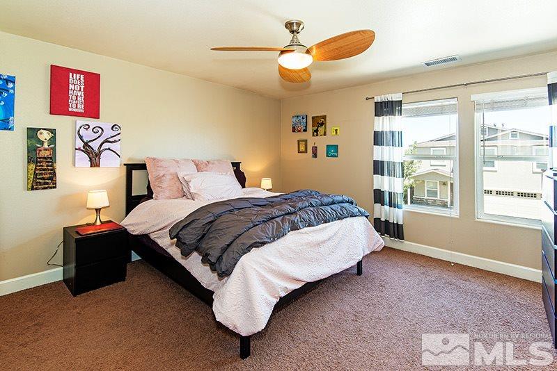 2916 Bryan Street Reno, NV 89503 - Photo 11 of 18 a bedroom with a bed dresser and a window