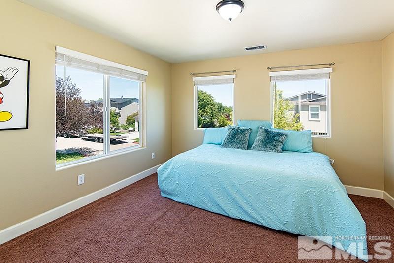2916 Bryan Street Reno, NV 89503 - Photo 14 of 18 a bedroom with a bed and a window