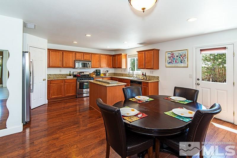 2916 Bryan Street Reno, NV 89503 - Photo 8 of 18 a view of a dining room with furniture window and wooden floor