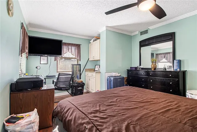 a view of walk in closet with clothes