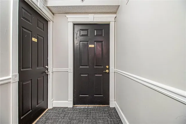 a view of hallway with wooden floor