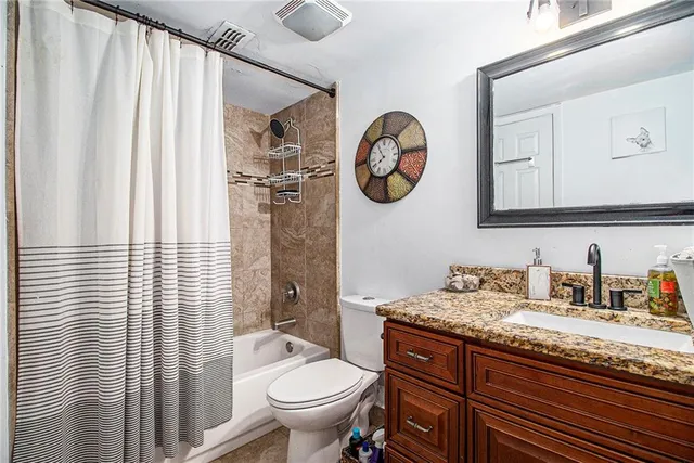 a utility room with sink dryer and washer