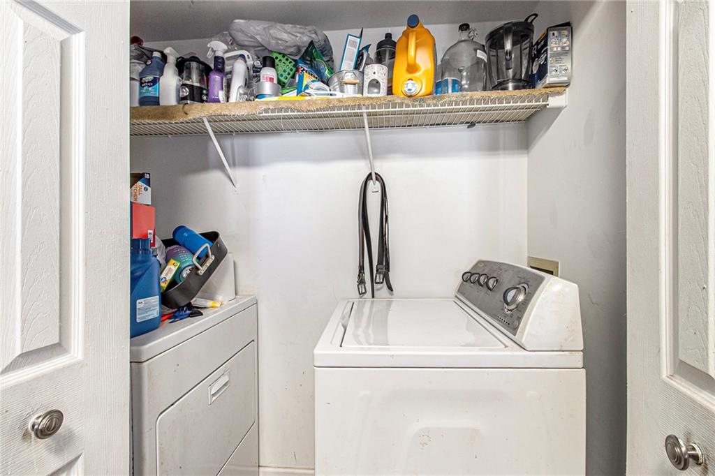 795 Hammond Drive, Unit 206 Atlanta, GA 30328 - Photo 29 of 29 a utility room with sink dryer and washer