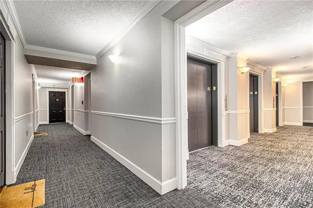 a kitchen with a refrigerator and a sink
