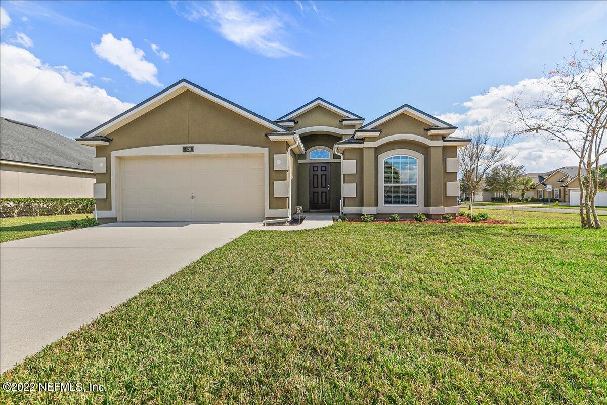 120 Toscana Lane St. Augustine, FL 32092 - Photo 1 of 29 a front view of a house with a yard and garage