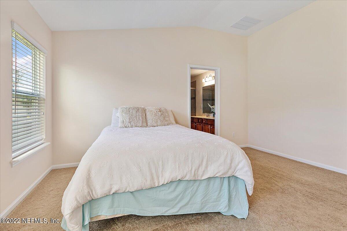 120 Toscana Lane St. Augustine, FL 32092 - Photo 12 of 29 a bedroom with a bed and window