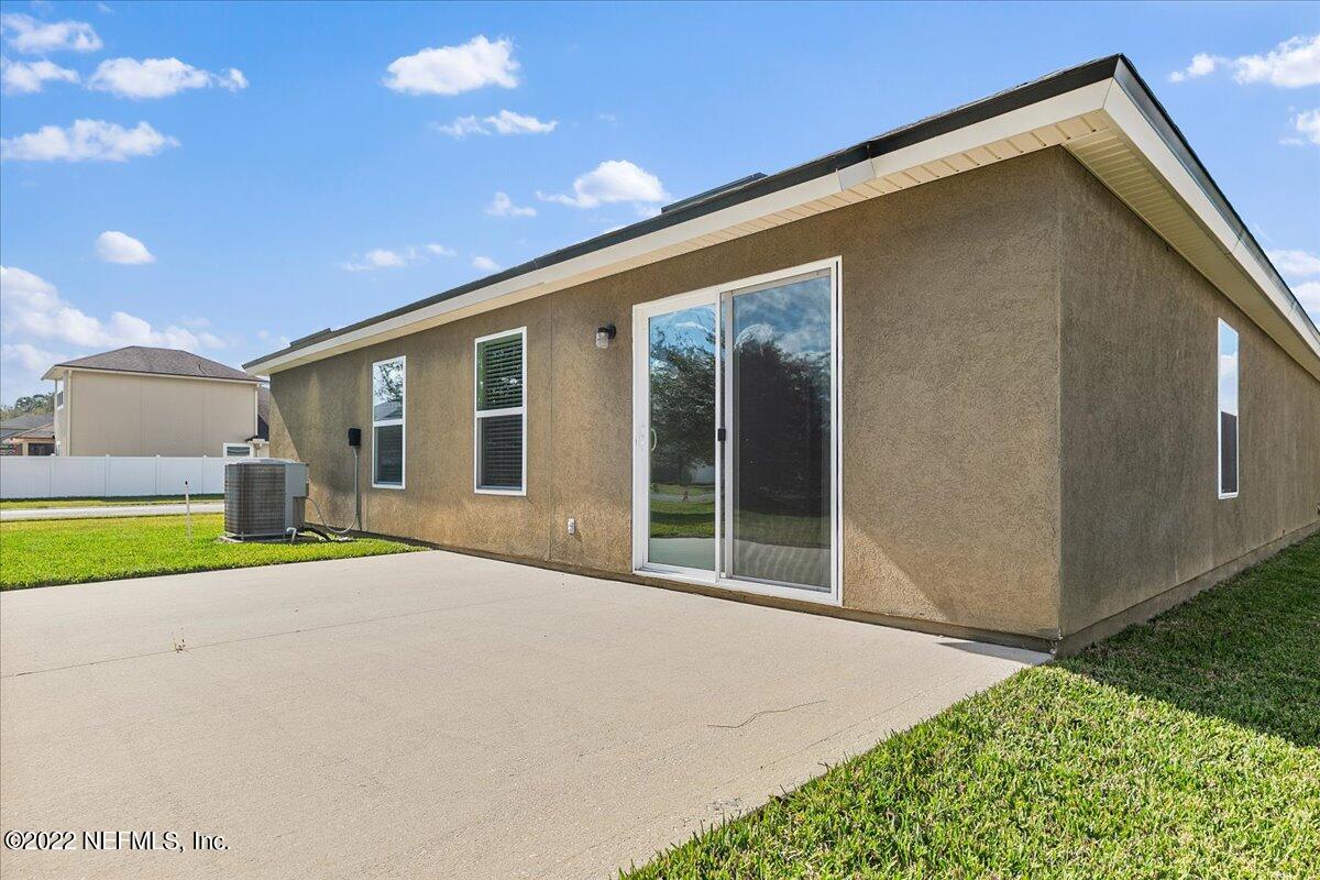 120 Toscana Lane St. Augustine, FL 32092 - Photo 20 of 29 a front view of a house with a yard and garage