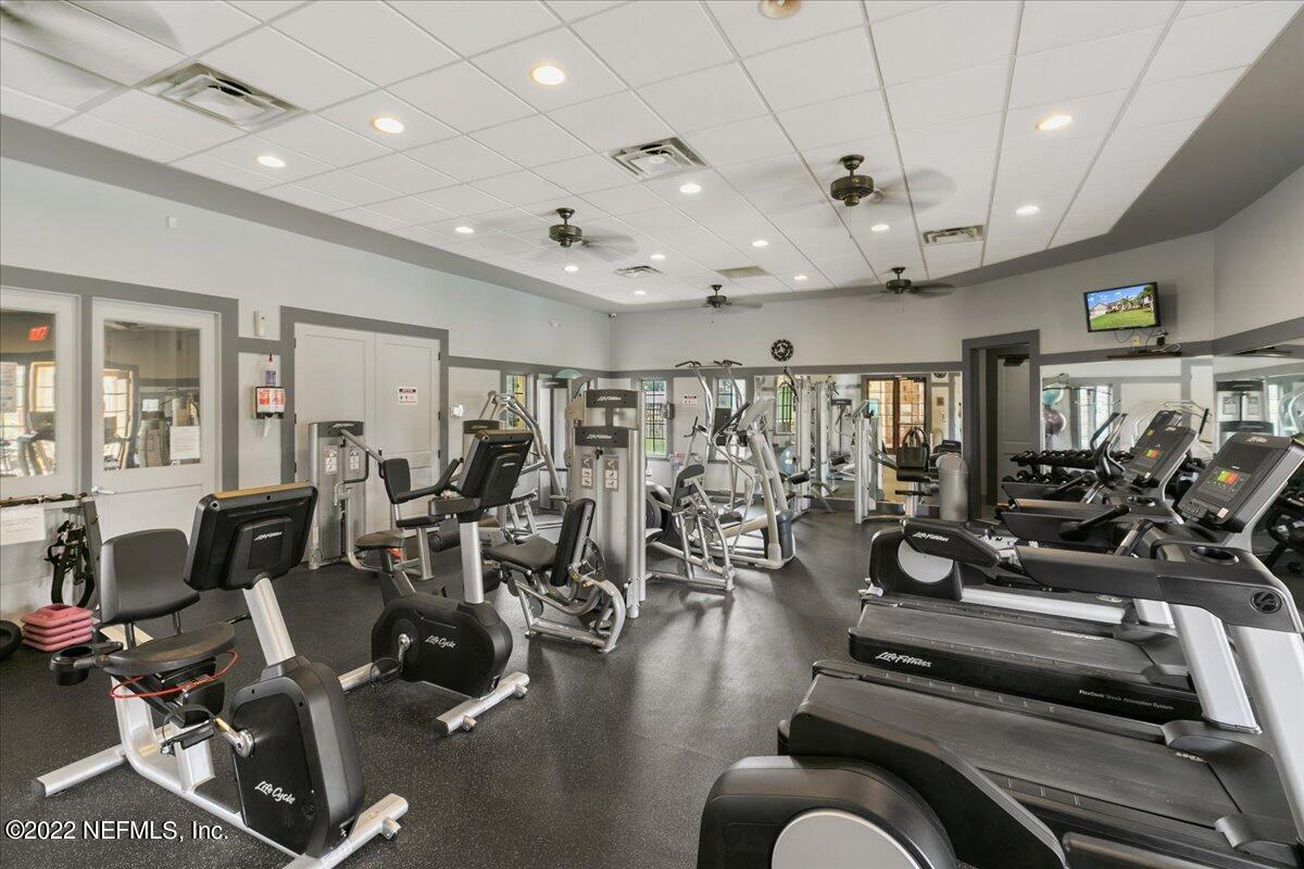 120 Toscana Lane St. Augustine, FL 32092 - Photo 24 of 29 a living room with lots of gym equipment
