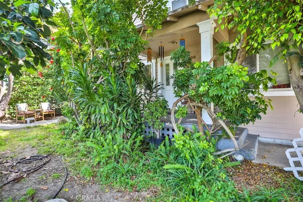front view of a house with a garden