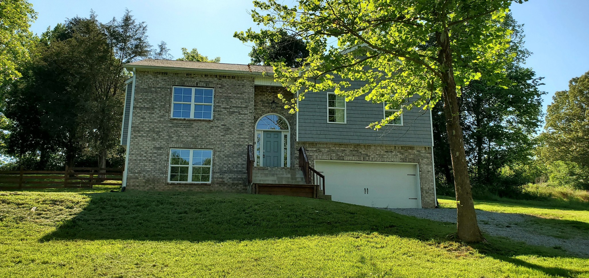 2004 McMahan Hollow Road Pleasant View, TN 37146 - Photo 1 of 17 a front view of a house with a garden