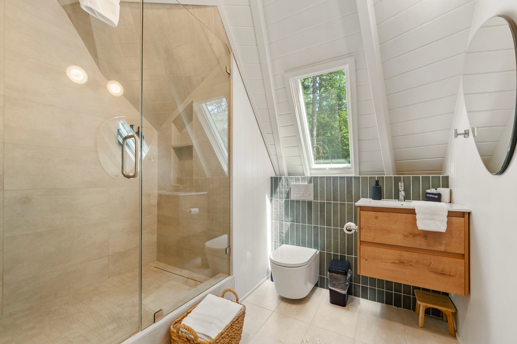 501 Gamble Road McCall, ID 83638 - Photo 14 of 28 Primary Bath, Glass and tile shower highlight this new bathroom.