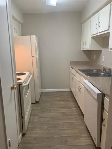 a kitchen with a sink a washer and dryer