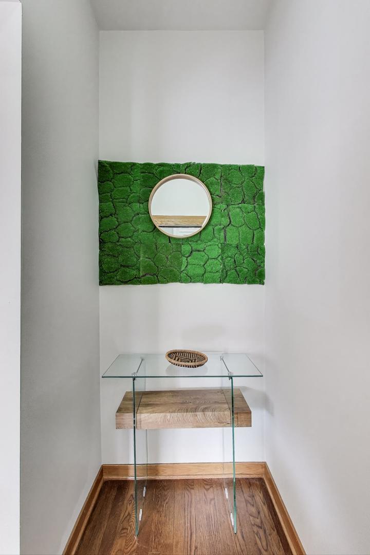 2720 West Polk Street, Unit 1 Chicago, IL 60612 - Photo 2 of 13 a view of a room with wooden floor and white walls