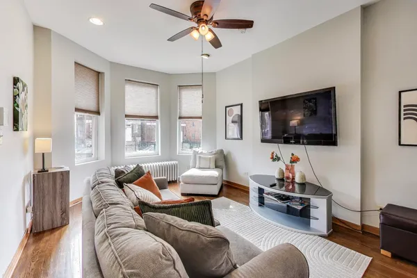 a living room with furniture and a flat screen tv