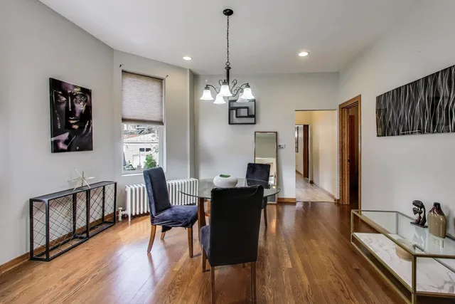 a view of a dining room with furniture and wooden floor