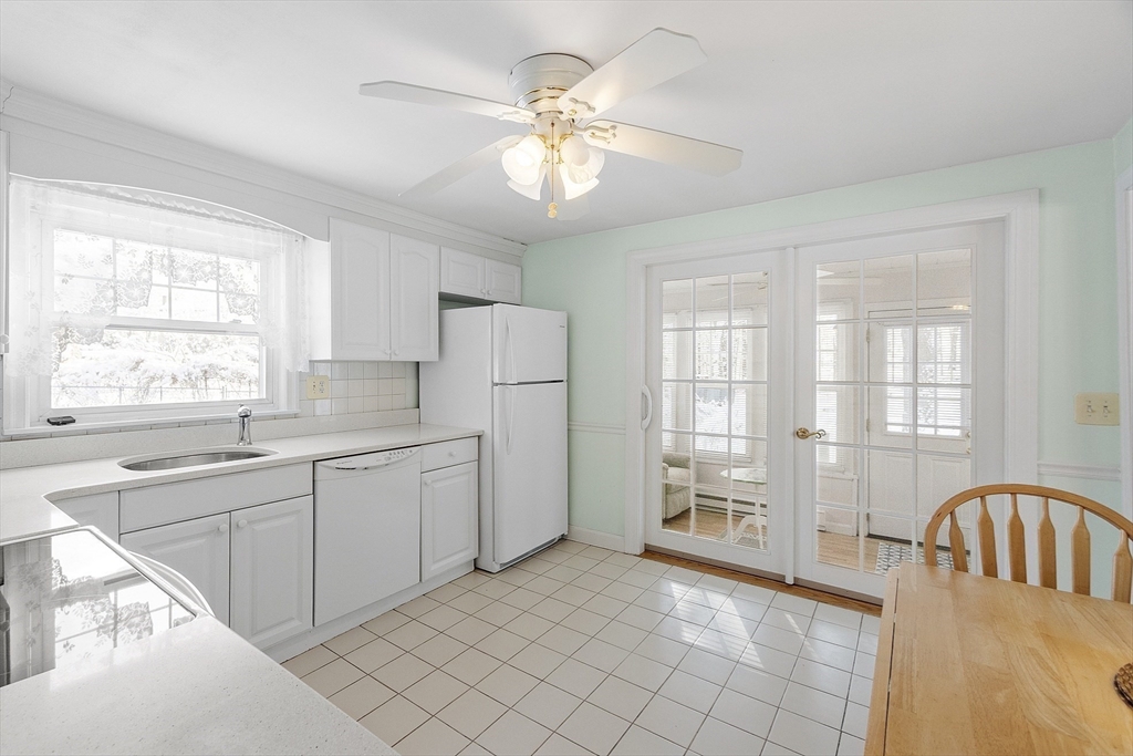 18 Frank Street Chelmsford, MA 01863 - Photo 11 of 38 a view of a kitchen with a sink dishwasher a refrigerator and cabinets