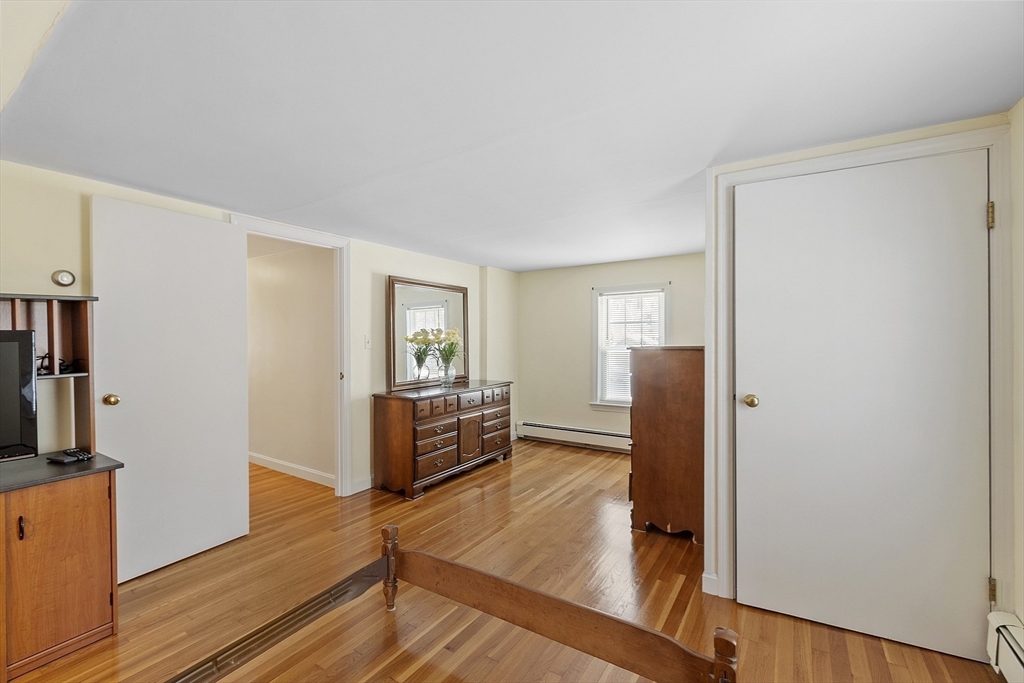 18 Frank Street Chelmsford, MA 01863 - Photo 20 of 38 a living room with furniture and a flat screen tv