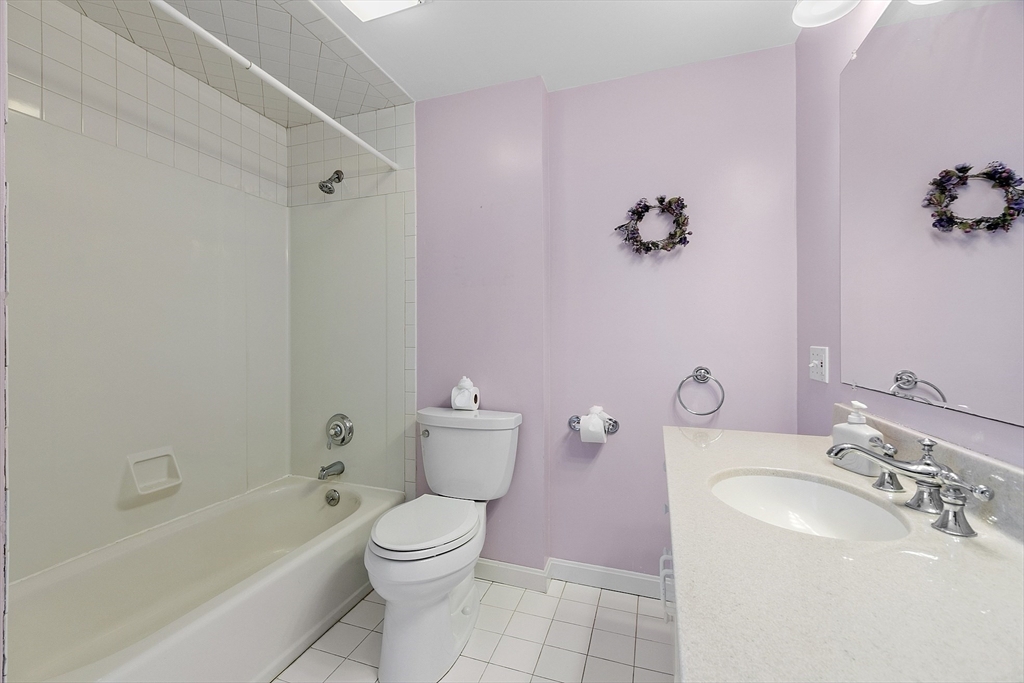 18 Frank Street Chelmsford, MA 01863 - Photo 23 of 38 a bathroom with a sink toilet and shower