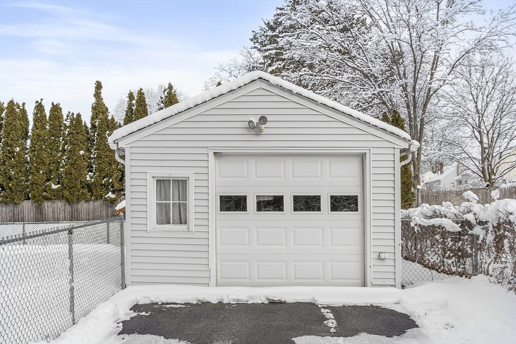18 Frank Street Chelmsford, MA 01863 - Photo 31 of 38 a view of a white house with large windows